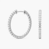 Crafted in 14K/18K gold or platinum, these inside-out hoops feature 2.00 ctw lab grown diamonds, prong-set with hinged snap closure and rhodium finish | Adorn By You