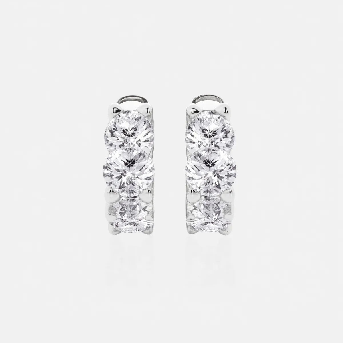 These Cushion Lab Grown Diamond Huggie Hoop Earrings feature three brilliant lab-grown diamonds in each earring, available in 1, 2, and 3 carat weight options in 14K or 18K gold, they offer timeless elegance, sustainable luxury, and exceptional sparkle for any sophisticated jewelry collection | Adorn By You