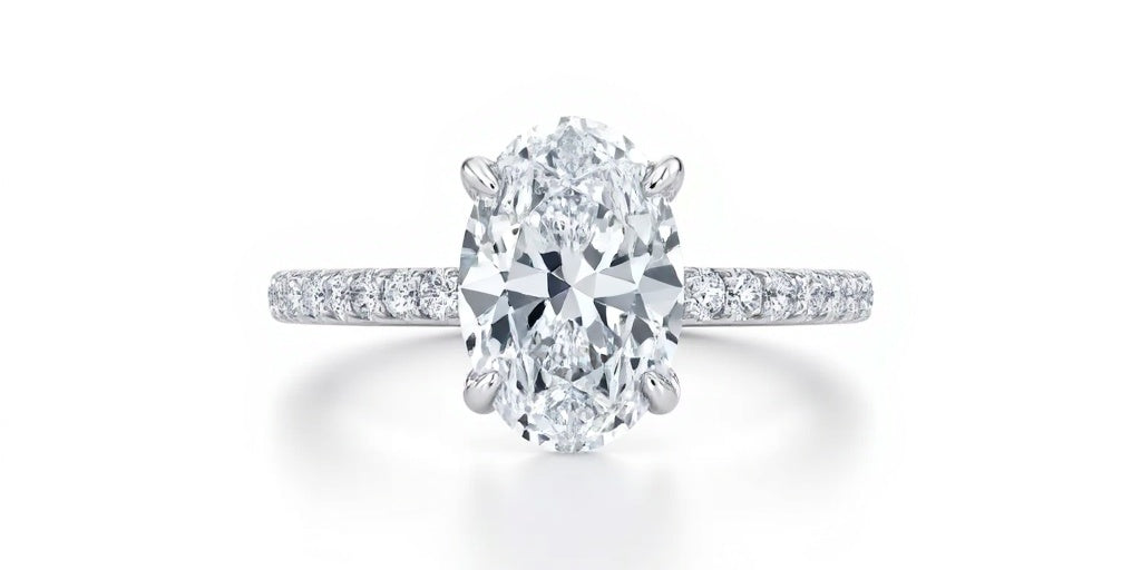 Oval Solitaire Engagement Ring with side Halo and  Pavé Band  | Adorn By You