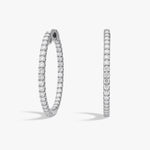 14K or 18K gold and platinum, these inside-out hoop earrings feature 40 round lab grown diamonds totaling 2.00 carats, prong-set for maximum visibility. Finished with a hinged snap closure, the hoops measure 0.84 inches in length and 0.08 inches in width, rhodium plated for shine | Adorn  By You